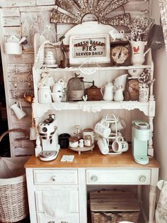 a white hutch filled with lots of items