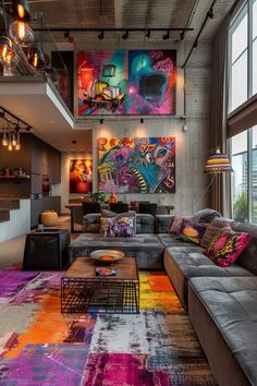 a living room filled with lots of furniture next to a large painting on the wall