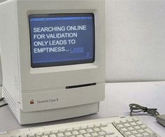 an old computer sitting on top of a desk next to a keyboard and mouse with the message searching online for variation only leads to happiness