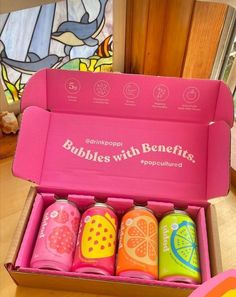 a pink box filled with different types of drinks