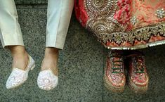 the feet of two people in wedding shoes