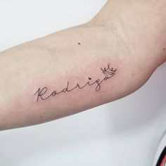 a person with a tattoo on their arm that reads radwigg and has a crown