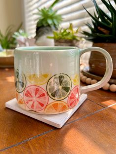 a coffee cup sitting on top of a wooden table