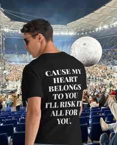 a man wearing a t - shirt that says cause my heart belongs to you i'll rise for you