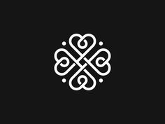 a black and white logo with an intricate design in the middle, on a dark background