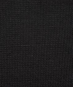 a black cloth textured with small squares