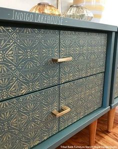 an old dresser has been painted with metallic paint