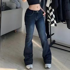 These denim jeans offer a classic throwback with their flared silhouette, hugging the hips and thighs before flaring out for a dramatic, stylish finish. Perfect for versatile wear, their low-rise design pairs seamlessly with both crop tops and oversized tees, catering to a variety of styles from retro to modern chic. Denim material Contrast sewing details Button & zip fastening Belt loop details Double pockets at front & back Low rise Cotton, polyester Low Waist Trousers, Casual Korean Fashion, Grunge Jeans, Mode Zara, Pants Streetwear, Streetwear Jeans, Low Waist Jeans, Stretch Denim Fabric, Y2k Jeans