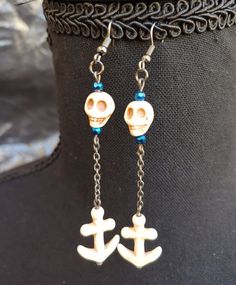 Jewelry fit for a sultry sea siren or a salty sea wench. Made with iridescent glass beads in deep blue oceanic hues and howlite skulls and anchors complemented with antiqued silver chain. Earrings are approximately 3 inches long. Earrings come with your choice of standard ear hook for pierced ears or Clip-on closures for non-pierced ears.  Both are hypoallergenic nickel-free metal alloy.  Please note the example image as a reference to the standard hook and clip on shapes only.  The finish of th Sea Siren, Ren Fair, Pirate Skull, Deep Ocean, Character Ideas, Ear Hook, Chain Earrings, Ocean Blue, Blue Beads