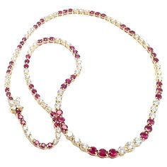 18k Yellow Gold Diamond And Ruby Victoria Line Necklace by Tiffany & Co. With 61 Round brilliant cut diamonds and 4 marque cut diamonds VS1 clarity, G color total weight approximately 5.70ct 60 round rubies total weight approximately 7.50ct This necklace comes with Tiffany & Co box. Details: Length: 16.25" Width: from 4mm to 3mm Lock: 7mm Weight: 20.8 grams Stamped Hallmarks: Tiffany & Co 750 *Free Shipping within the United States* YOUR PRICE: $45,000 T3435odadd Tiffany Victoria Necklace, Red And Gold Tiffany Necklace, Tiffany And Co Victoria, Tiffany And Co Schlumberger Necklace, Luxury Ruby Diamond Necklace, Yellow Gold Ruby Necklace With Diamond Cut, Tiffany And Co Yellow Diamond Necklace, Tiffany And Co Box, Ruby Diamond Necklace