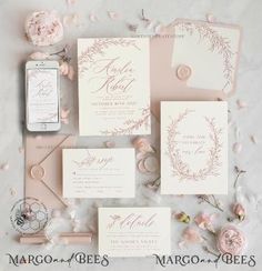 the wedding stationery is laid out with pink flowers and greenery, including an iphone