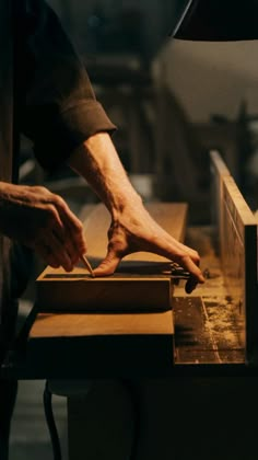 a person working on a piece of wood