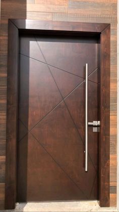 a wooden door with a metal handle on it