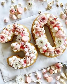 the number 50 is made out of cookies and marshmallows with flowers on them