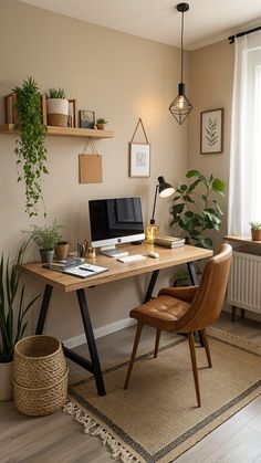 a desk with a computer and some plants on it