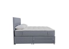 a bed with a pull out headboard and mattress on it's side, in front of a white background