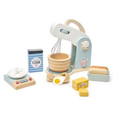 a wooden toy kitchen set with eggs, cheese and other items to make it look like an electric mixer