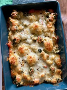 a casserole dish with broccoli and cheese