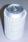 an aluminum can sitting on top of a white table