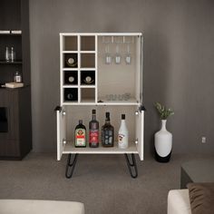 an entertainment center with bottles and glasses on it