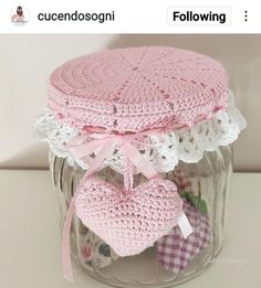 there is a jar with some crocheted items in it