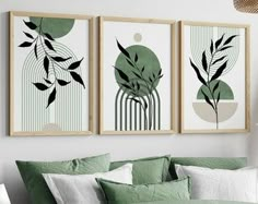 three framed art prints on the wall above a bed with green sheets and pillows in a bedroom