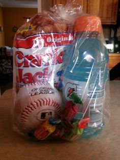 a plastic bag filled with sports items on top of a counter