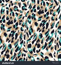 an animal print background with blue and brown spots