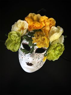 Add a touch of nature’s beauty to your ensemble with this Yellow & Green Floral Mask from the Embroidered Venetian Garden Bloom collection. Featuring vibrant yellow and green flowers, this mask is adorned with intricate embroidery that captures the essence of blooming gardens. Perfect for masquerade balls, garden parties, and elegant events, this mask blends floral artistry with traditional Venetian craftsmanship.

Age Group/Gender - Adult/Women

Size/Type - One size fits all adults

Mask Color Venetian Garden, Mardi Gras Kid, Kids Party Packs, Yellow And Green Flowers, Floral Mask, Female Mask, Garden Parties, Masquerade Ball, Intricate Embroidery