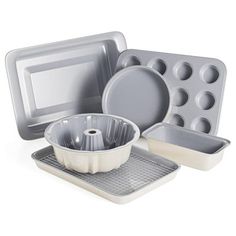 an assortment of bakeware and cake pans