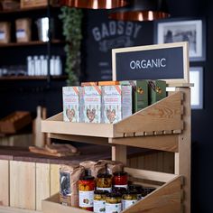 the shelves are filled with spices and condiments for sale in front of the counter