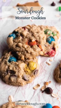 three cookies with m & m on top and the words sourdough monster cookies