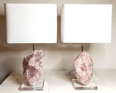 "Frankie" and "Grace" are  made from two beautiful pieces of natural Rose Quartz from the United States.  These one-of-a-kind lamps are 23" tall.  The stones are approximately 10" tall and 6" wide, and they are mounted on custom-cut acrylic bases that measure 6" x 7".   The lamps feature nickel-plated hardware.  The off-white rectangular shades are 13" wide by 8.5" deep by 10" high. The lamps use energy-efficient 3-way LED bulbs up to 150 watts, which are included. The Rose Quartz crystals are securely mounted into the acrylic bases using a small metal peg, which is not visible when the stones are in place. Each stone is easily removable for shipping and/or moving purposes. Each lamp in the Crystal Luxe Decor collection is made from natural stones that will create timeless and sophisticate Rose Quarts Lamp, Designer Table Lamps, Bethesda Maryland, Luxe Decor, Designer Table, Table Lamp Design, Rose Quartz Crystal, Crystals Minerals, Live Light