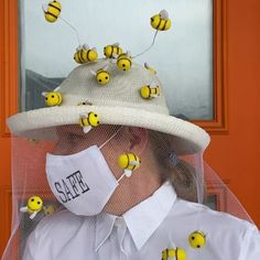 a person wearing a hat with bees on it and the words salt written on it