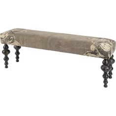 an upholstered bench with wooden legs and a floral fabric cover on it's back