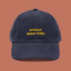 Stand up, stand out, and protect queer kids with our stylish Protect Queer Kids Corduroy Hat! This isn't just any hat--it's a powerful statement piece that champions inclusivity and celebrates the future generations of the LGBTQIA+ community. Let your hat do the talking and elevate your style with our embroidered vintage cap. Meticulously crafted from premium 100% cotton corduroy, this hat ensures a gentle feel against your skin and a comfortable fit. Its timeless design features an adjustable s Weird Sweaters, Queer Clothing, Mode Queer, Queer Outfits, Kids Corduroy, Embroidered Corduroy, Corduroy Cap, Dope Hats, My First Rodeo