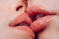 a woman's lips with their tongue out