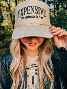 EXPENSIVE the attitude is free Love love this one! So sassy and fun. Khaki foam trucker hat with black puff print. The hat chain is not included Hat Chain, Funny Trucker Hat, Boho Rock, A T, Custom Trucker Hats, Free Love, Hat Print, Puff Print, Matching Tees