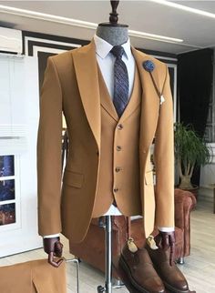 Are you planning a wedding or other social event that you want to look good and stand out in the crowd? Then this suit is a must have.  It is carefully made and finished with the best of fabric.  It comes in brown color but can be customized in any color of your choice.  Product Details: 1. Brown 3 piece single breasted suit (jacket/coat, vest/waistcoat & pants). 2. Sewed with a blend of cotton and wool fabric of high quality. Best fabric for suits. 3. Comes in sizes XS to 3XL. For larger sizes, Brown Groomsmen Suits, Brown Groomsmen, Modern Fit Suit, Morning Suits, Brown Fits, Brown Suits, Brown Wedding, Groomsmen Suits, Color Cafe