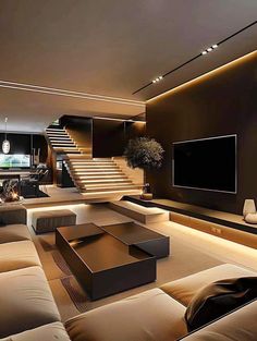 a living room with couches and a television on the wall in front of stairs