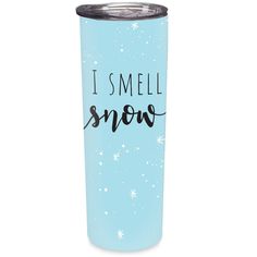 a blue tumbler with the words i smell snow on it and stars in the background