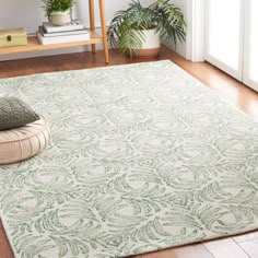 a green rug on the floor in a room