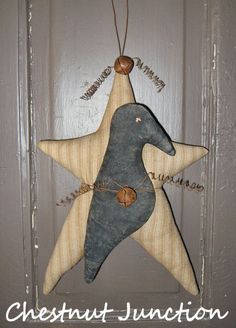 an ornament hanging from the side of a door with a star on it