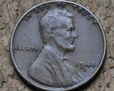 a close up of a coin on a wall