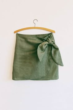 a green skirt hanging on a hanger with the words sewing pattern sew - along video