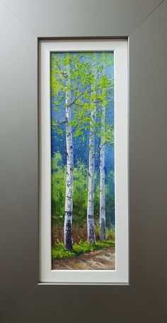 a painting of trees in the woods with blue sky and green grass behind it, framed on a wall