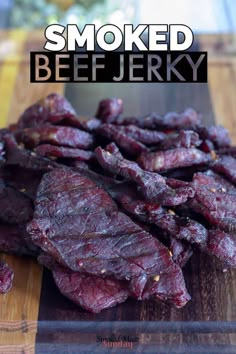 smoked beef is shown on a cutting board with the words smoked beef in black lettering