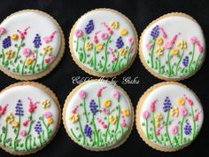 six decorated cookies with flowers on them