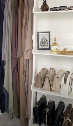 a white shelf filled with shoes and handbags