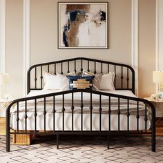 a black metal bed frame in a bedroom